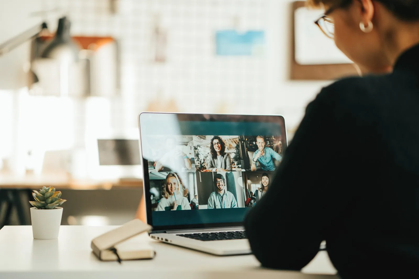 Online class grid view — engaged students and a coach on a video call